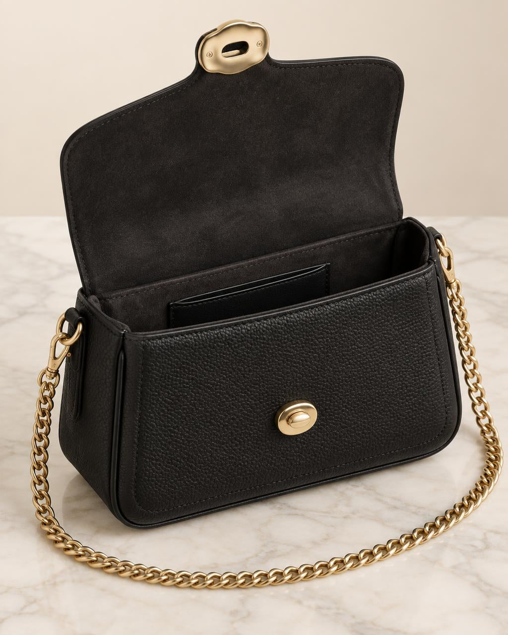 Tabby 19 bag open showing the suede lining and slip pocket